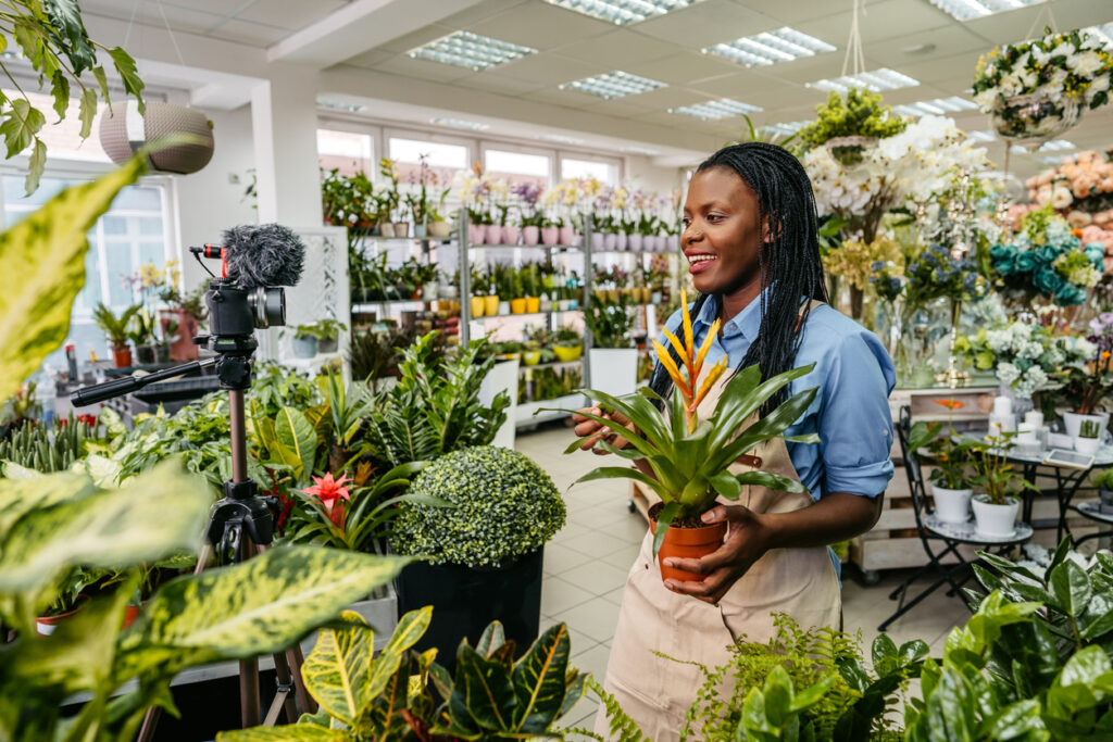 a florist making creative video content for her flower shop.